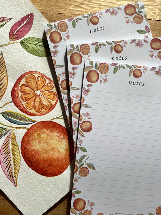 Notebook with fruit-themed design on pages and cover